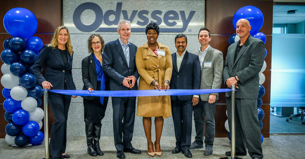 Members of Odyssey’s Executive Team standing next to each other at the ribbon cutting ceremony at the grand opening of the company’s new global headquarters in Charlotte, N.C.