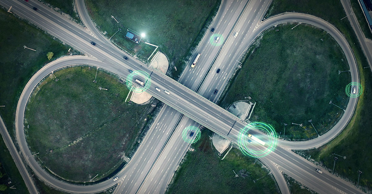 Aerial view of a busy highway intersection featuring multiple lanes of traffic